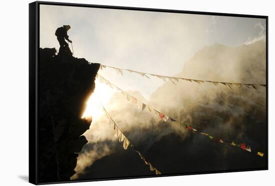 Climber on Kala Pattar Peak (5545M) with Buddhist Prayer Flags at Sunset, Nepal, Himalaya-Enrique Lopez-Tapia-Framed Stretched Canvas