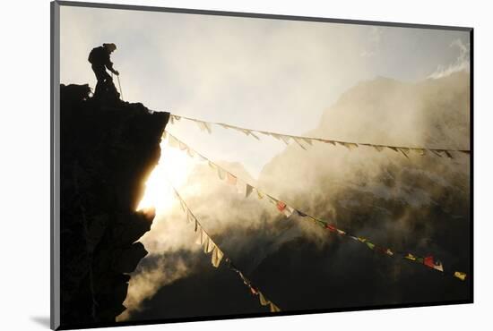 Climber on Kala Pattar Peak (5545M) with Buddhist Prayer Flags at Sunset, Nepal, Himalaya-Enrique Lopez-Tapia-Mounted Photographic Print