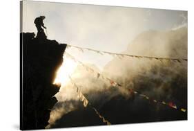 Climber on Kala Pattar Peak (5545M) with Buddhist Prayer Flags at Sunset, Nepal, Himalaya-Enrique Lopez-Tapia-Stretched Canvas