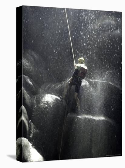 Climber Showered with Water in Cave, Mexico-Michael Brown-Stretched Canvas