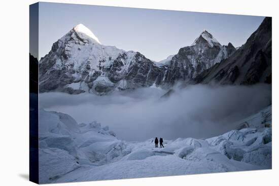 Climbers Navigate the Khumbu Icefall with Pumori and Lingtrin in the Background in Nepal-Kent Harvey-Stretched Canvas