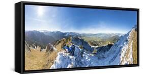 Climbers on steep crest covered with snow in the Ammergau Alps, Tegelberg, Fussen, Bavaria, Germany-Roberto Moiola-Framed Stretched Canvas