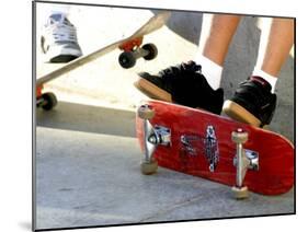 Close-up Image of Feet on Skateboards-null-Mounted Premium Photographic Print