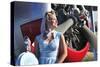 Close-Up of a 1940's Style Pin-Up Girl in Front of a Vintage F3F Biplane-null-Stretched Canvas