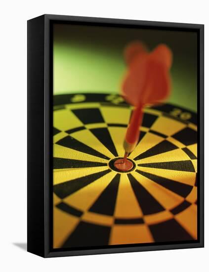 Close-up of a Dart in the Bull's-Eye of a Dartboard-null-Framed Stretched Canvas