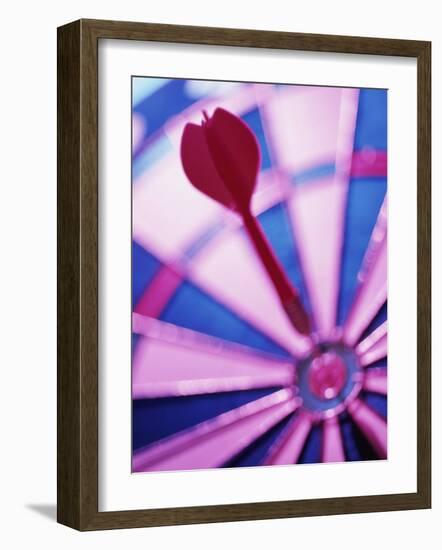 Close-up of a Dart in the Bull's-Eye of a Dartboard-null-Framed Photographic Print