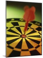 Close-up of a Dart in the Bull's-Eye of a Dartboard-null-Mounted Photographic Print