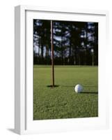Close-up of a Golf Ball Near the Hole-null-Framed Photographic Print