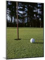 Close-up of a Golf Ball Near the Hole-null-Mounted Photographic Print
