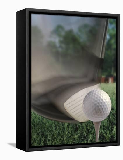 Close-up of a Golf Club Hitting a Golf Ball on a Tee-null-Framed Stretched Canvas