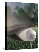 Close-up of a Golf Club Hitting a Golf Ball on a Tee-null-Stretched Canvas