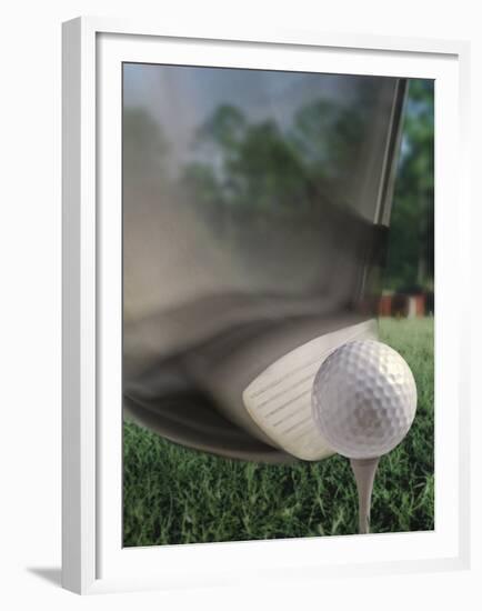 Close-up of a Golf Club Hitting a Golf Ball on a Tee-null-Framed Premium Photographic Print