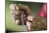 Close-up of a man's hands praying the rosary, France, Europe-Godong-Mounted Photographic Print