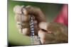 Close-up of a man's hands praying the rosary, France, Europe-Godong-Mounted Photographic Print