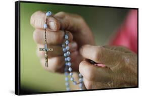 Close-up of a man's hands praying the rosary, France, Europe-Godong-Framed Stretched Canvas