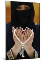 Close up of a Muslim woman's hands in abaya while holding rosary and praying, United Arab Emirates-Godong-Mounted Photographic Print