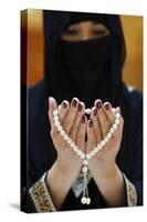 Close up of a Muslim woman's hands in abaya while holding rosary and praying, United Arab Emirates-Godong-Stretched Canvas