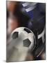 Close-up of a Soccer Player Kicking a Soccer Ball-null-Mounted Premium Photographic Print