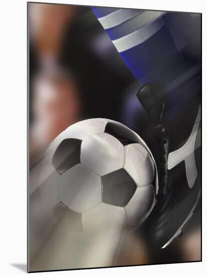 Close-up of a Soccer Player Kicking a Soccer Ball-null-Mounted Photographic Print