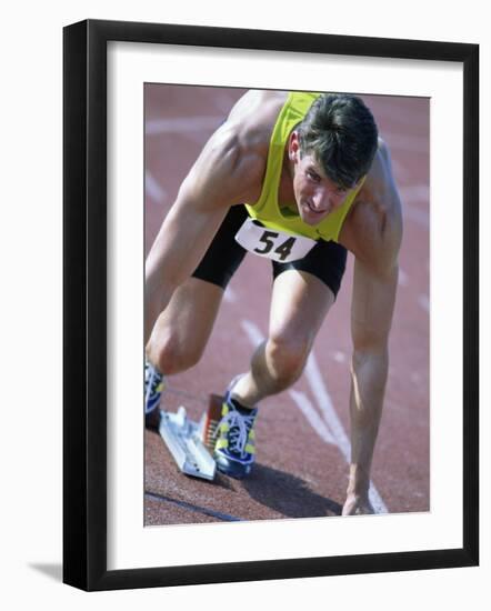Close-up of a Young Man in the Starting Position on a Running Track-null-Framed Premium Photographic Print