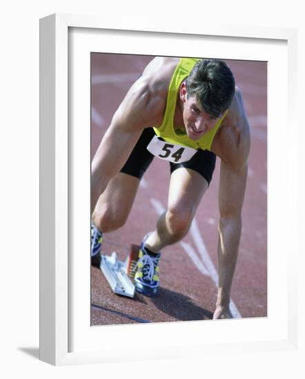 Close-up of a Young Man in the Starting Position on a Running Track-null-Framed Photographic Print