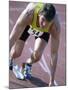 Close-up of a Young Man in the Starting Position on a Running Track-null-Mounted Photographic Print