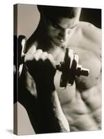 Close-up of a Young Man Working Out with a Dumbbell-null-Stretched Canvas