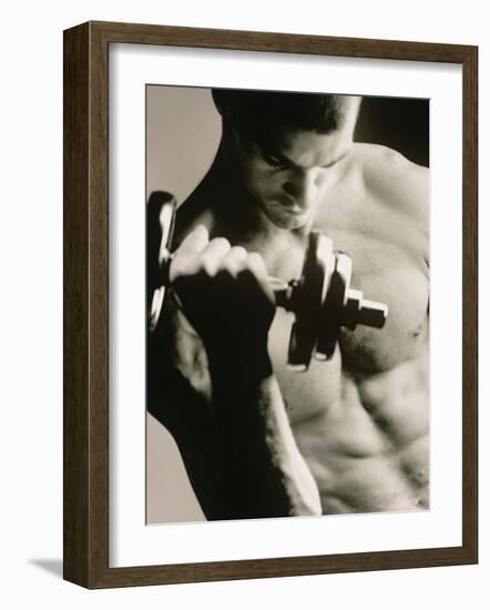 Close-up of a Young Man Working Out with a Dumbbell-null-Framed Premium Photographic Print