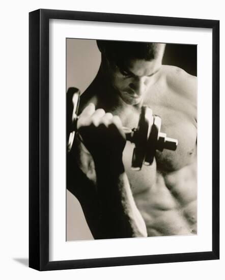 Close-up of a Young Man Working Out with a Dumbbell-null-Framed Premium Photographic Print