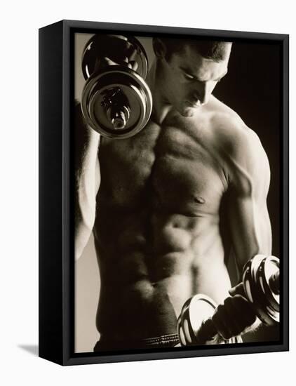 Close-up of a Young Man Working Out with Dumbbells-null-Framed Stretched Canvas