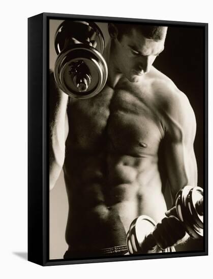 Close-up of a Young Man Working Out with Dumbbells-null-Framed Stretched Canvas