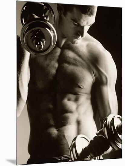 Close-up of a Young Man Working Out with Dumbbells-null-Mounted Photographic Print