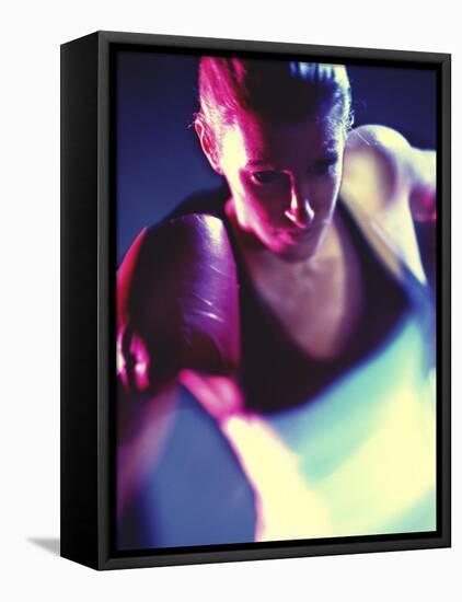 Close-up of a Young Woman Wearing Boxing Gloves-null-Framed Stretched Canvas