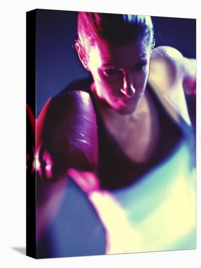 Close-up of a Young Woman Wearing Boxing Gloves-null-Stretched Canvas