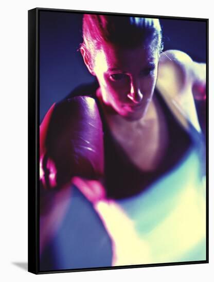 Close-up of a Young Woman Wearing Boxing Gloves-null-Framed Stretched Canvas