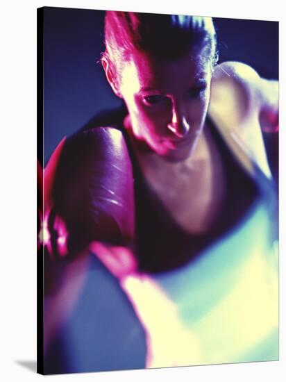 Close-up of a Young Woman Wearing Boxing Gloves-null-Stretched Canvas