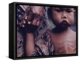 Close-Up of an Indonesian Child Holding on to the Hand of His Mother-Co Rentmeester-Framed Stretched Canvas