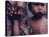 Close-Up of an Indonesian Child Holding on to the Hand of His Mother-Co Rentmeester-Stretched Canvas
