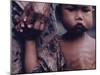 Close-Up of an Indonesian Child Holding on to the Hand of His Mother-Co Rentmeester-Mounted Photographic Print