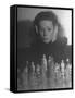 Close Up of Danielle Darrieux Looking at Chess Pieces-David Scherman-Framed Stretched Canvas