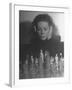 Close Up of Danielle Darrieux Looking at Chess Pieces-David Scherman-Framed Premium Photographic Print