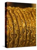 Close up of Gold Bangles on Display, the Gold Souk, Deira, Dubai, United Arab Emirates, Middle East-Amanda Hall-Stretched Canvas