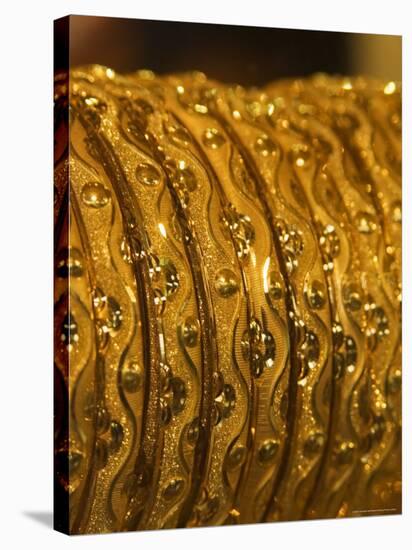 Close up of Gold Bangles on Display, the Gold Souk, Deira, Dubai, United Arab Emirates, Middle East-Amanda Hall-Stretched Canvas