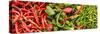 Close-Up of Green and Red Chili Peppers at Market Stall-null-Stretched Canvas