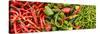 Close-Up of Green and Red Chili Peppers at Market Stall-null-Stretched Canvas