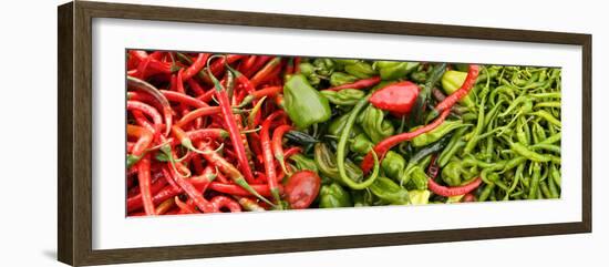 Close-Up of Green and Red Chili Peppers at Market Stall-null-Framed Photographic Print