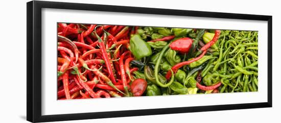 Close-Up of Green and Red Chili Peppers at Market Stall-null-Framed Photographic Print