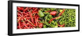 Close-Up of Green and Red Chili Peppers at Market Stall-null-Framed Photographic Print