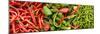 Close-Up of Green and Red Chili Peppers at Market Stall-null-Mounted Photographic Print