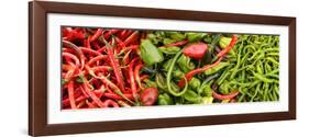 Close-Up of Green and Red Chili Peppers at Market Stall-null-Framed Photographic Print